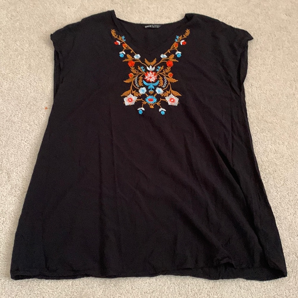 Sleeves are a bit small. Material is thin.